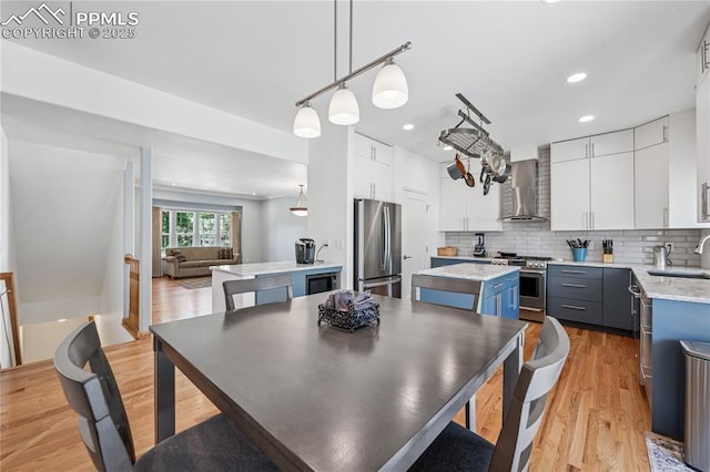 2664 Emerald Ridge Dr, Colorado Springs, CO 80920 - dining space with light wood-style flooring and recessed lighting