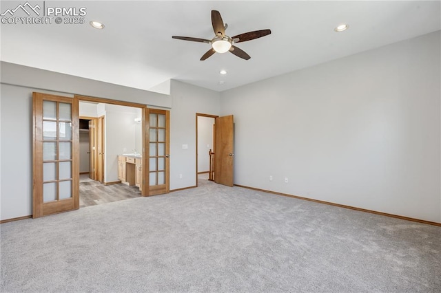 2664 Emerald Ridge Dr, Colorado Springs, CO 80920 - unfurnished bedroom with french doors, light carpet, recessed lighting, ceiling fan, and ensuite bath