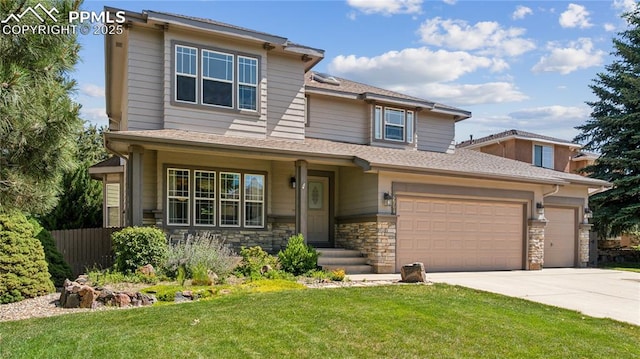 2664 Emerald Ridge Dr, Colorado Springs, CO 80920 - view of front of home featuring concrete driveway and stone siding