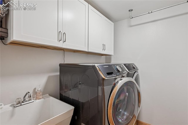 2664 Emerald Ridge Dr, Colorado Springs, CO 80920 - washroom with cabinet space and washer and clothes dryer