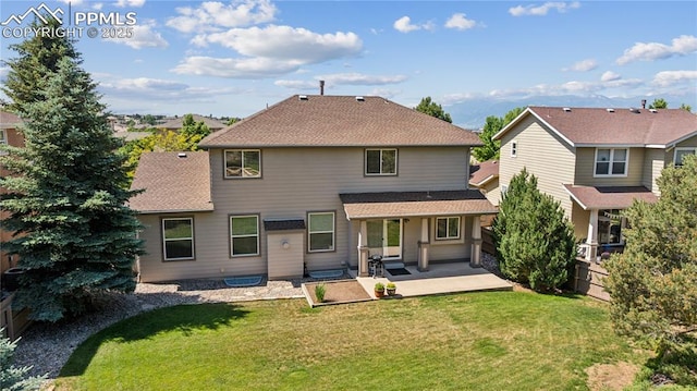 2664 Emerald Ridge Dr, Colorado Springs, CO 80920 - rear view of house with a patio area and a shingled roof