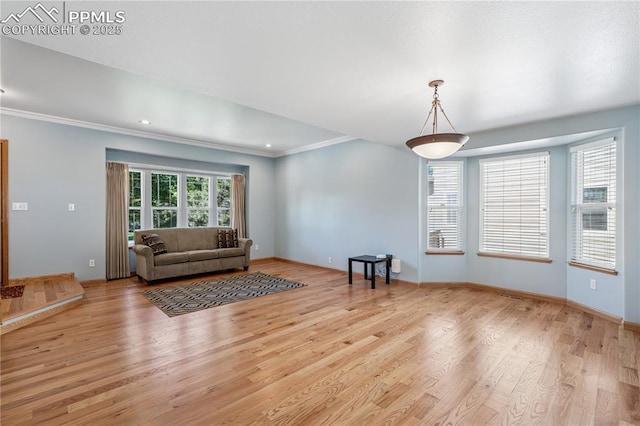 2664 Emerald Ridge Dr, Colorado Springs, CO 80920 - living area featuring light wood-style flooring, crown molding, and recessed lighting