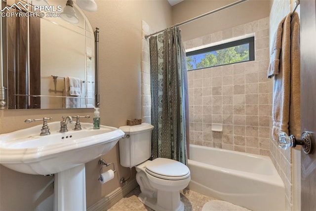 2585 Dunfries Ct, Colorado Springs, CO 80919 - full bathroom with shower / bath combo with shower curtain and tile patterned flooring