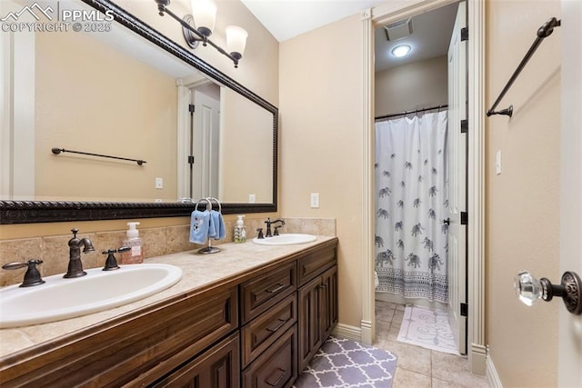 2585 Dunfries Ct, Colorado Springs, CO 80919 - full bathroom with tile patterned floors, double vanity, and a shower with shower curtain