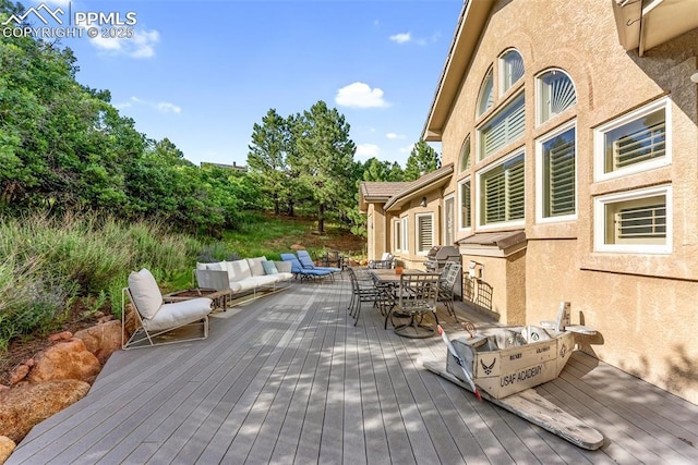 2585 Dunfries Ct, Colorado Springs, CO 80919 - deck featuring outdoor dining area and an outdoor hangout area