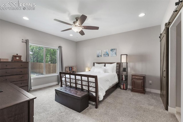 501 N Franklin St, Colorado Springs, CO 80903 - bedroom with a barn door, light colored carpet, recessed lighting, and ceiling fan