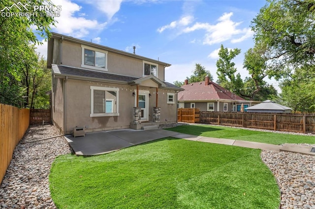 501 N Franklin St, Colorado Springs, CO 80903 - rear view of property featuring stucco siding, a fenced backyard, and a patio area