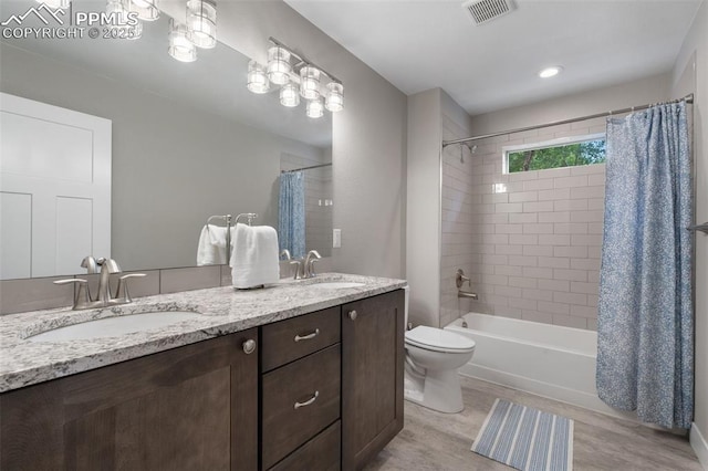 501 N Franklin St, Colorado Springs, CO 80903 - bathroom featuring shower / bath combo, double vanity, and wood finished floors