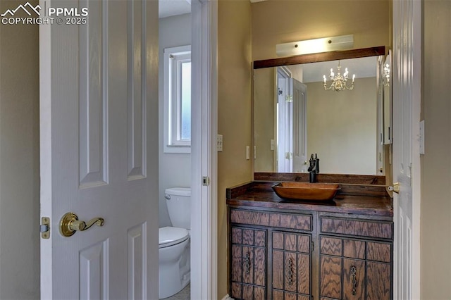 5926 Del Paz Dr, Colorado Springs, CO 80918 - bathroom featuring vanity and a chandelier