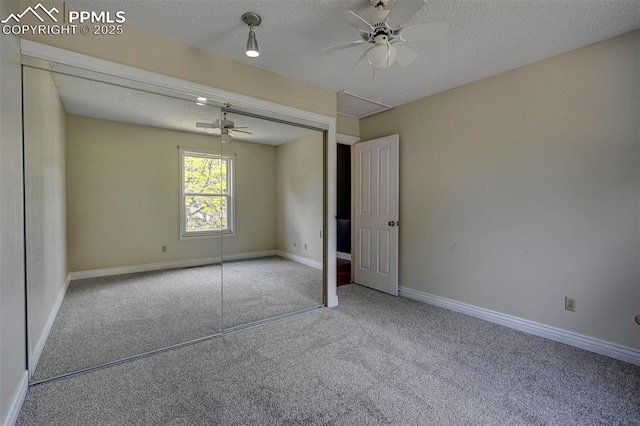 5926 Del Paz Dr, Colorado Springs, CO 80918 - unfurnished bedroom with carpet, a textured ceiling, a closet, and a ceiling fan