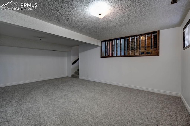 5926 Del Paz Dr, Colorado Springs, CO 80918 - finished basement featuring a textured ceiling, carpet, and stairway