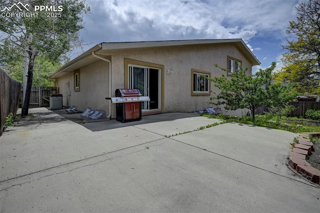 5926 Del Paz Dr, Colorado Springs, CO 80918 - back of house featuring stucco siding, a patio area, and a fenced backyard