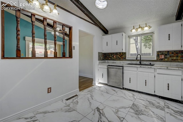 5926 Del Paz Dr, Colorado Springs, CO 80918 - kitchen with stainless steel dishwasher, decorative backsplash, a textured ceiling, light marble finish flooring, and lofted ceiling