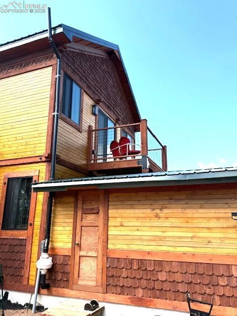 714 Woodrock Way, Divide, CO 80814 - rear view of house featuring a balcony