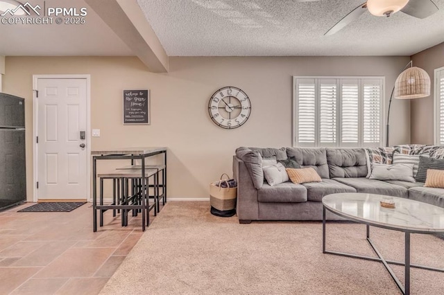1607 N Chestnut St, Colorado Springs, CO 80907 - carpeted living room with ceiling fan and a textured ceiling