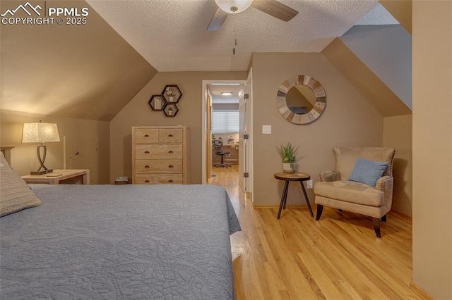 1607 N Chestnut St, Colorado Springs, CO 80907 - bedroom with light wood-style floors, lofted ceiling, ceiling fan, and a textured ceiling