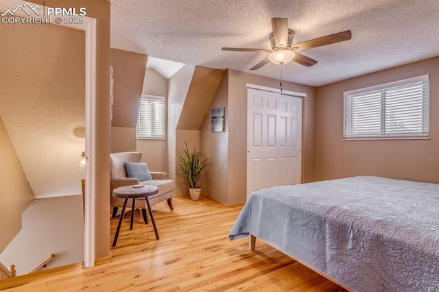 1607 N Chestnut St, Colorado Springs, CO 80907 - bedroom featuring a textured ceiling, wood finished floors, a closet, and ceiling fan