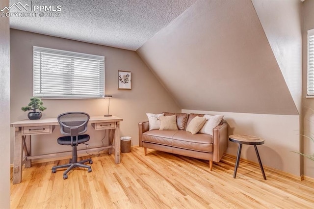 1607 N Chestnut St, Colorado Springs, CO 80907 - office with wood finished floors, lofted ceiling, and a textured ceiling