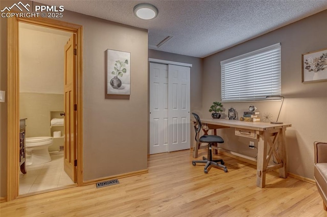 1607 N Chestnut St, Colorado Springs, CO 80907 - office featuring light wood-type flooring and a textured ceiling