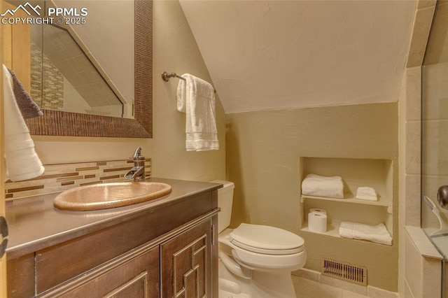 1607 N Chestnut St, Colorado Springs, CO 80907 - bathroom featuring vanity, vaulted ceiling, and tile patterned floors