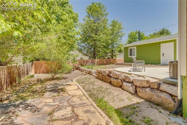 1607 N Chestnut St, Colorado Springs, CO 80907 - fenced backyard featuring a patio area