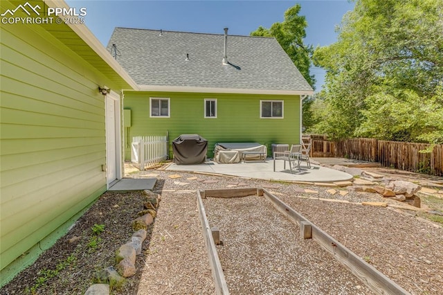 1607 N Chestnut St, Colorado Springs, CO 80907 - fenced backyard with a patio area and a garden