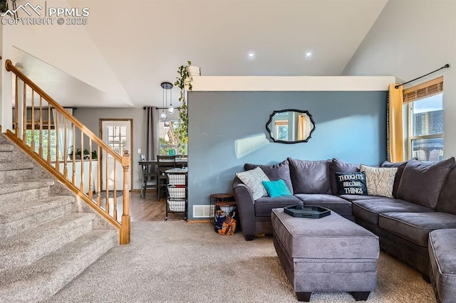 6931 Mcewan St, Colorado Springs, CO 80922 - living area featuring lofted ceiling, stairway, recessed lighting, and carpet flooring