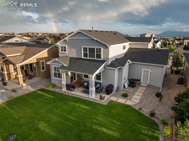 4296 New Santa Fe Trl, Colorado Springs, CO 80924 - back of house featuring entry steps, a shingled roof, and a patio
