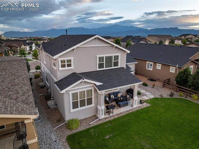 4296 New Santa Fe Trl, Colorado Springs, CO 80924 - back of house featuring outdoor lounge area, a mountain view, stucco siding, a patio, and a residential view