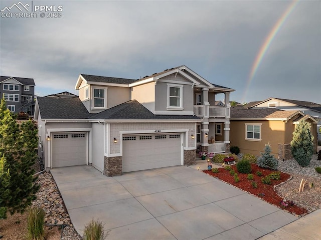 4296 New Santa Fe Trl, Colorado Springs, CO 80924 - craftsman-style house with concrete driveway, stone siding, stucco siding, a balcony, and a garage