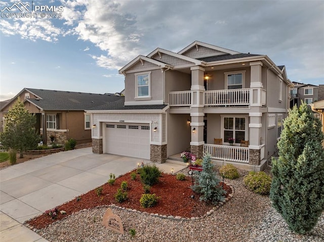 4296 New Santa Fe Trl, Colorado Springs, CO 80924 - craftsman inspired home featuring a balcony, covered porch, stone siding, and stucco siding