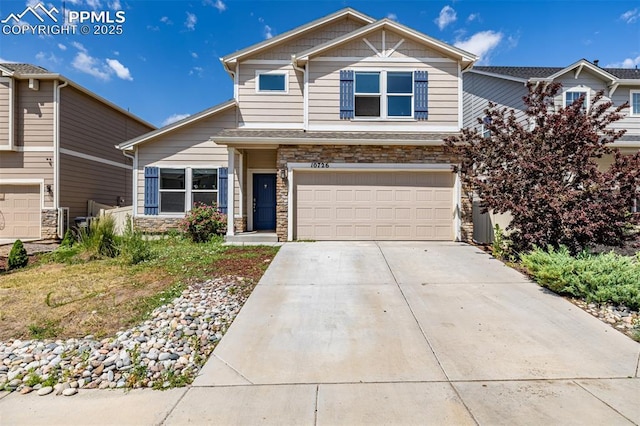 10726 Traders Pkwy, Fountain, CO 80817 - view of front of property featuring stone siding, a garage, and driveway