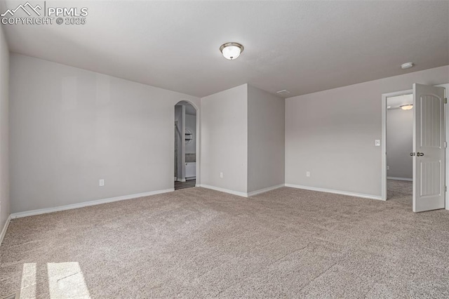 10726 Traders Pkwy, Fountain, CO 80817 - carpeted empty room with arched walkways and a smoke detector