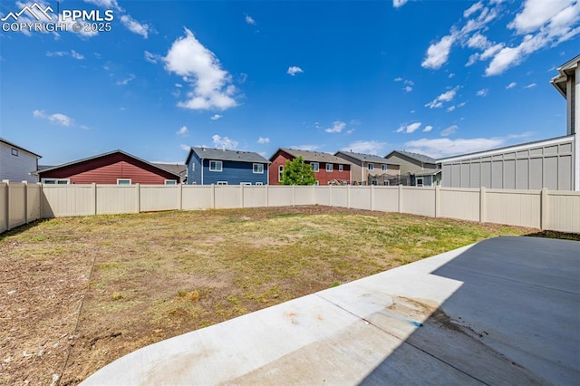 10726 Traders Pkwy, Fountain, CO 80817 - fenced backyard featuring a patio and a residential view