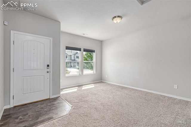 10726 Traders Pkwy, Fountain, CO 80817 - entrance foyer with carpet flooring and wood finished floors