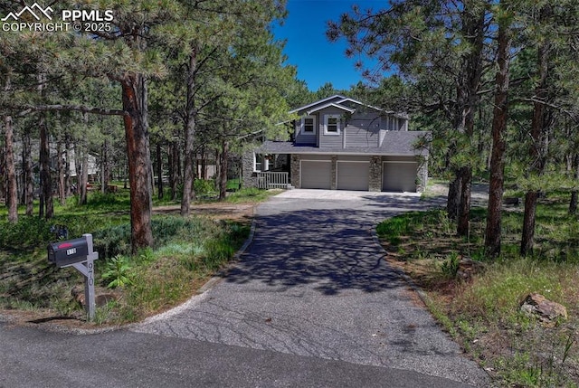 970 Bend In The Trail Rd, Monument, CO 80132 - view of front of property featuring driveway and a garage