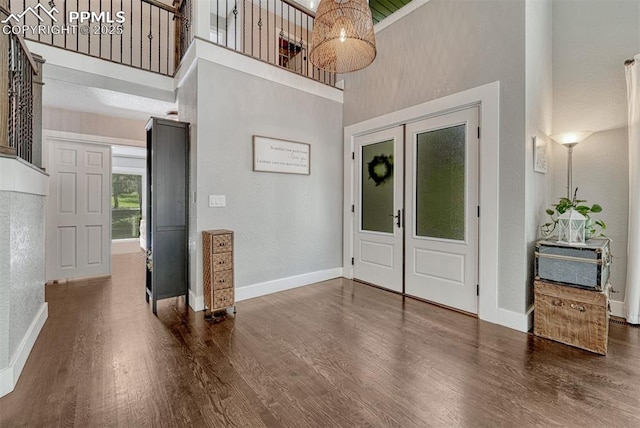 970 Bend In The Trail Rd, Monument, CO 80132 - foyer with a towering ceiling, wood finished floors, and stairs