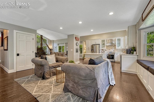 970 Bend In The Trail Rd, Monument, CO 80132 - living room featuring dark wood-style flooring, stairs, recessed lighting, and a textured ceiling