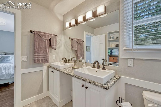 970 Bend In The Trail Rd, Monument, CO 80132 - ensuite bathroom with a textured wall and double vanity