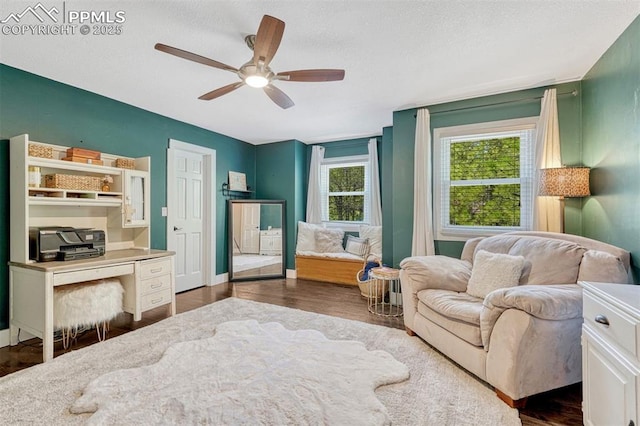 970 Bend In The Trail Rd, Monument, CO 80132 - bedroom with a textured ceiling, ceiling fan, and dark wood-style floors