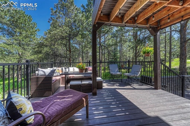 970 Bend In The Trail Rd, Monument, CO 80132 - wooden terrace featuring outdoor lounge area and view of scattered trees