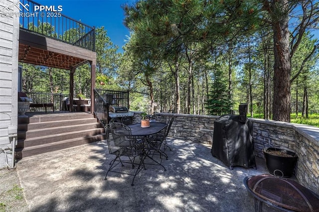970 Bend In The Trail Rd, Monument, CO 80132 - patio / terrace with a patio area, outdoor dining area, and a grill