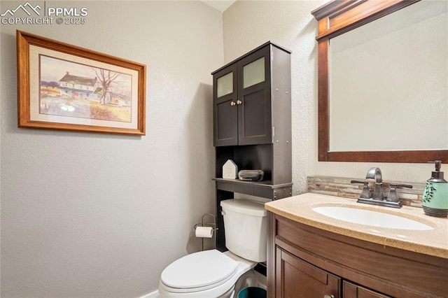 2527 Elite Ter, Colorado Springs, CO 80920 - half bath with vanity and a textured wall