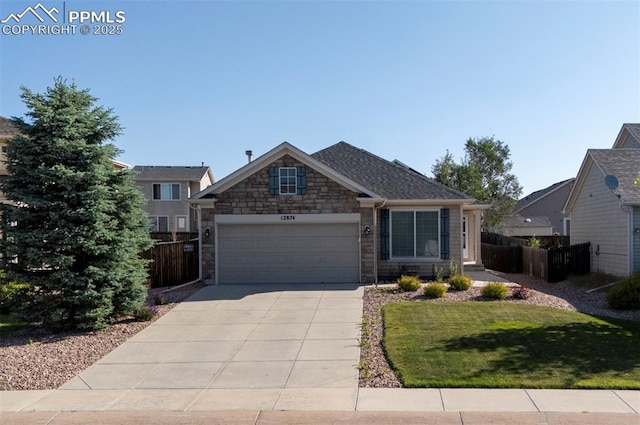 12874 Oakland Hills Rd, Peyton, CO 80831 - view of front facade with concrete driveway, an attached garage, and stone siding