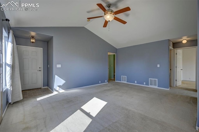 12874 Oakland Hills Rd, Peyton, CO 80831 - spare room featuring vaulted ceiling, a ceiling fan, and carpet flooring