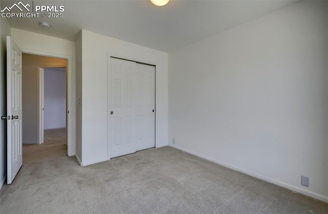 12874 Oakland Hills Rd, Peyton, CO 80831 - unfurnished bedroom with light colored carpet and a closet