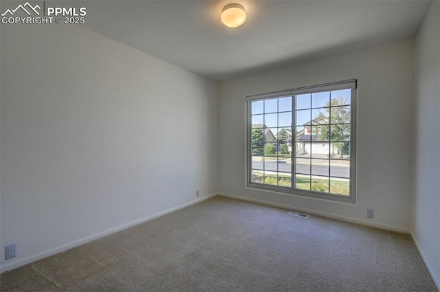 12874 Oakland Hills Rd, Peyton, CO 80831 - carpeted empty room with baseboards