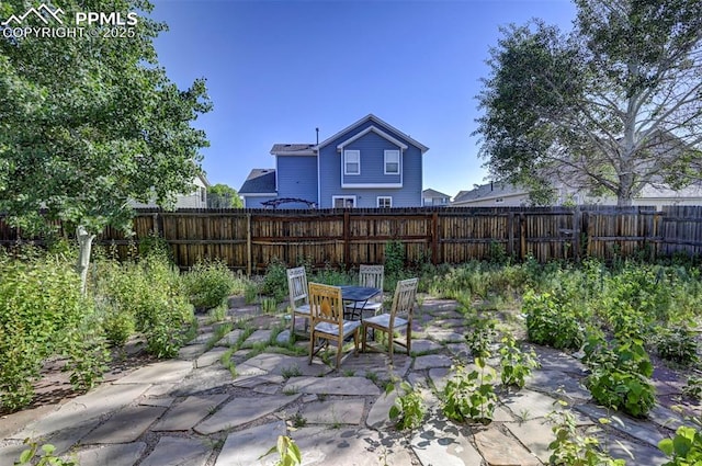 12874 Oakland Hills Rd, Peyton, CO 80831 - fenced backyard with a patio area and outdoor dining space
