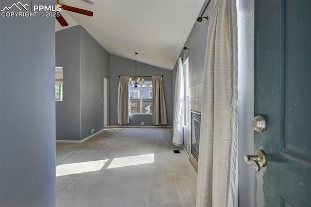 12874 Oakland Hills Rd, Peyton, CO 80831 - unfurnished living room featuring a ceiling fan, a chandelier, lofted ceiling, and carpet
