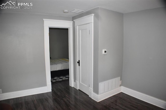 305 W 2nd St, Florence, CO 81226 - unfurnished room with dark wood-style flooring